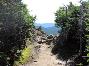 trail with cairn in mountains