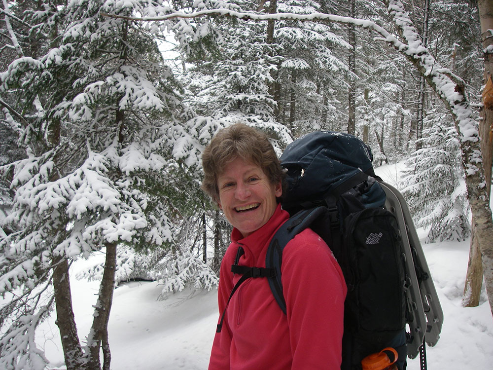 hiker on trail climbing Mt. Washington
