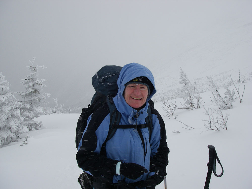 hiker on trail climbing Mt. Washington