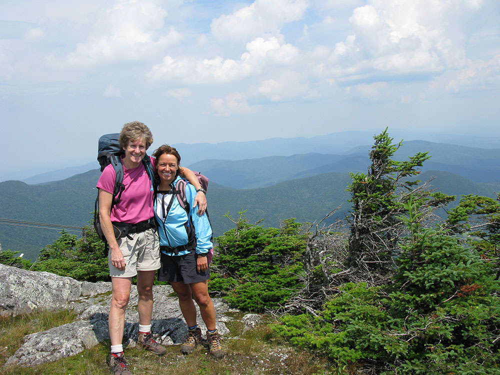 two hikers at summit of Jay Peak