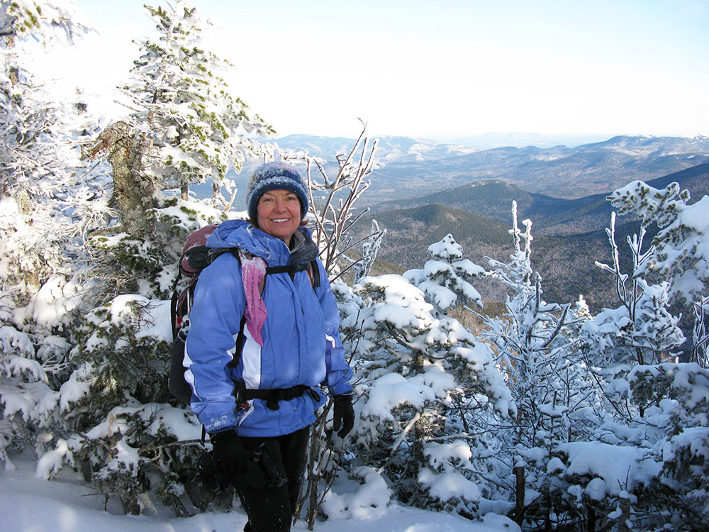 hiker on trail on Tripyramid Ridge in White Mountains