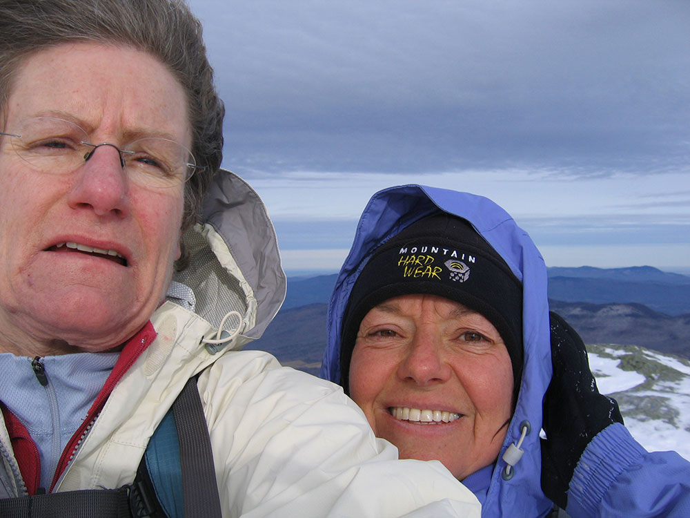 Two hikers at the summit
