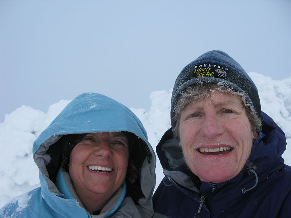 two hikers on the summit of Mt Galehead