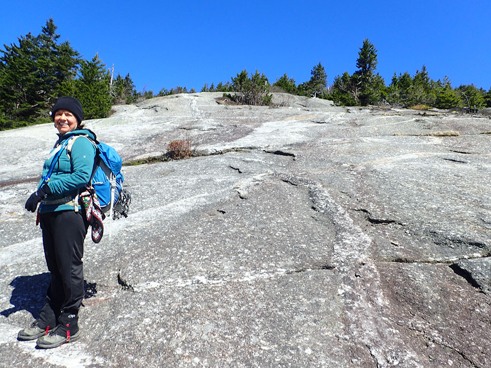 hiker on rock slab