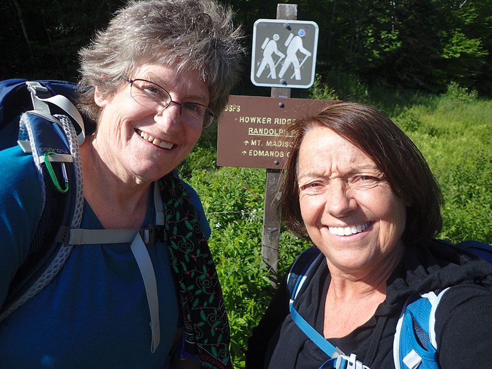 two hikers taking a selfie at the trailhead
