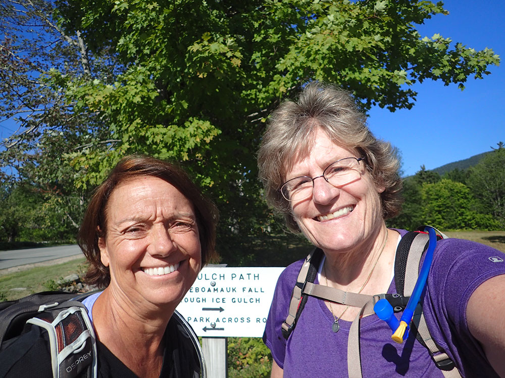 two hikers taking a selfie at the trailhead