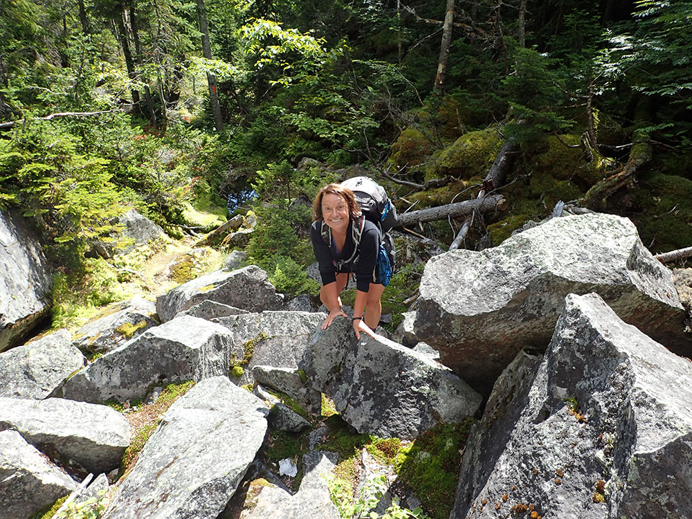 hiker climbing the talus field