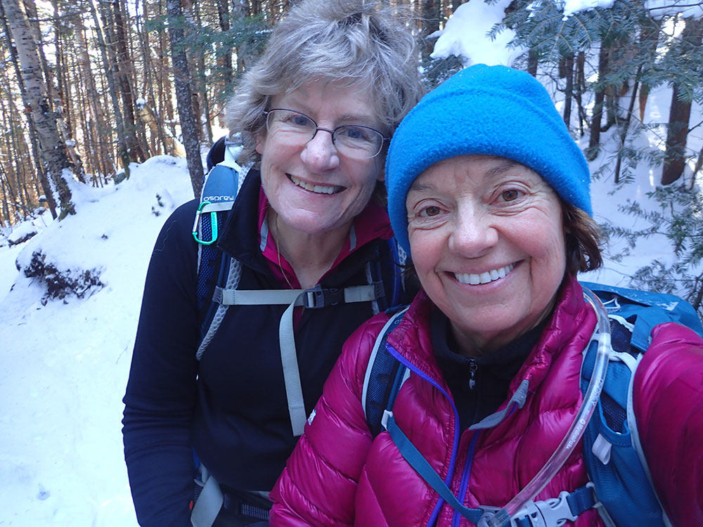 two hikers taking a selfie at the end of a hike