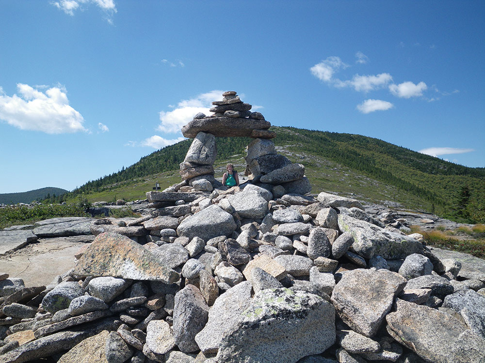hiker climbing toward the summit