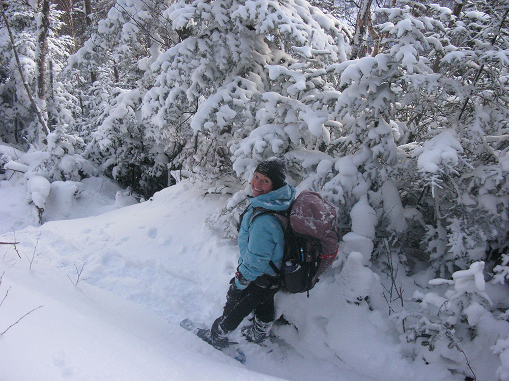 Nancy hiker in snowshoes on the trail