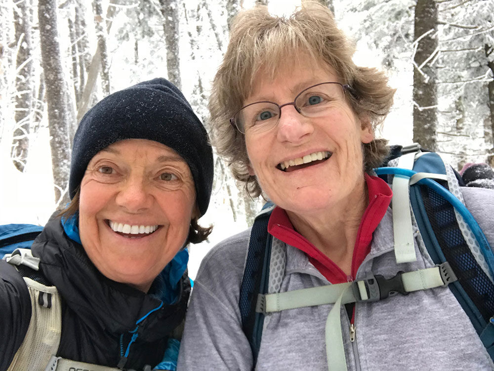 two hikers taking a selfie at the trailhead