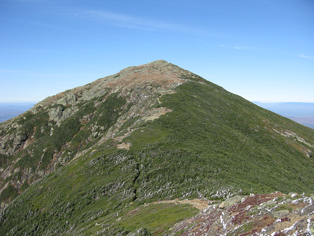 view of mountain on a ridge above tree line in the fall