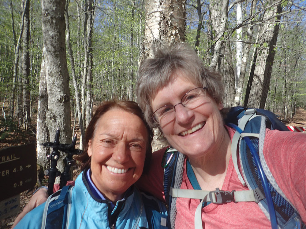 two hikers taking a selfie at the trailhead