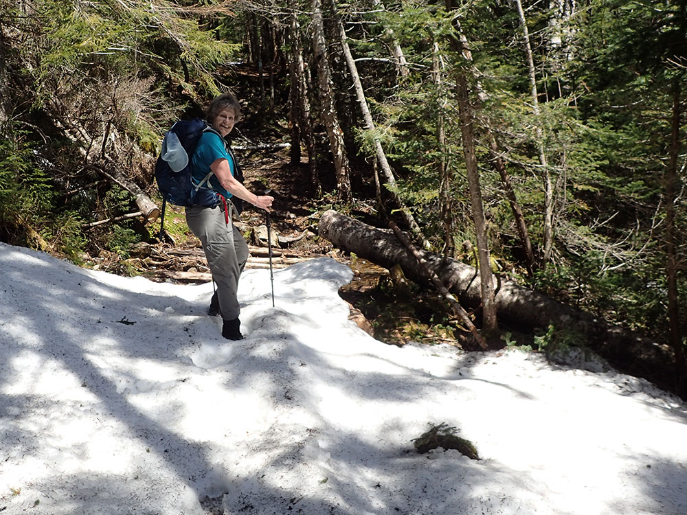 hiker walking in rotten snow