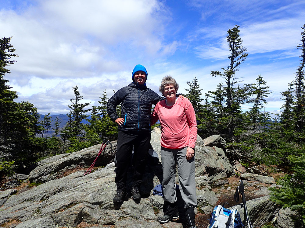 two hikers on the summit of Sandwich Dome