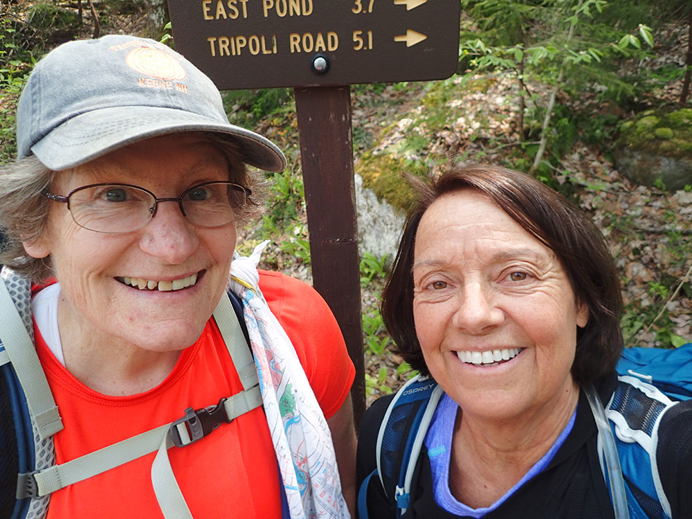 two hikers taking a selfie at the end of their hike