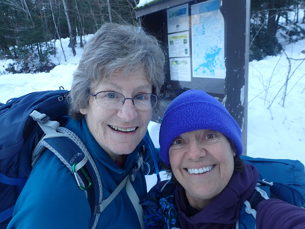 two hikers taking a selfie at the trailhead