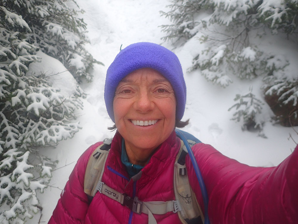 hiker taking a selfie in the snow