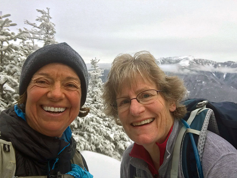 two hikers taking a selfie during their hike